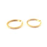 A pair of 18ct gold and diamond hoop earrings