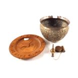 An Indian brass jardiniere, Russian carved wooden bread plate,