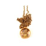 A 9ct gold St Christopher pendant on yellow metal chain