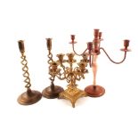 Two four branch candelabra and a pair of Edwardian brass barley twist candlesticks