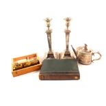 A pair of silver plated candlesticks, teapot, pocket microscope and book, History of Suffolk by J.J.