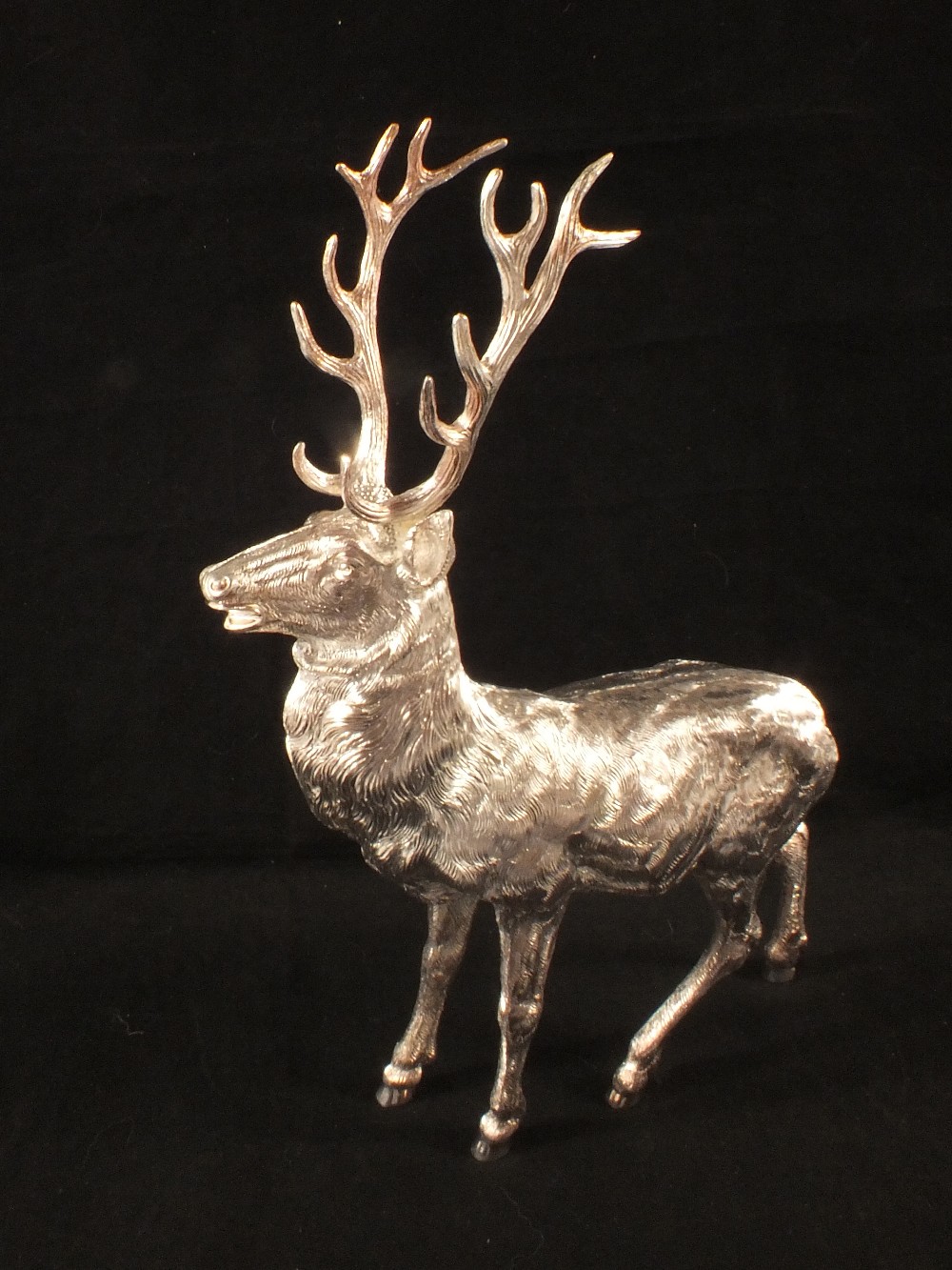 A silver model of a stag by C.J.