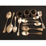A selection of silver spoons plus napkin rings