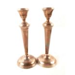 A pair of silver candlesticks (marks rubbed)