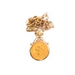 A 1914 half sovereign in 9ct gold mount on 9ct gold chain