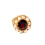 A 9ct gold pearl and garnet set ring,
