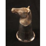 A silver stirrup cup in the form of a horses head with gilt interior by C.J.