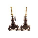 A pair of heavy brass and iron andirons,