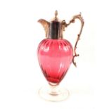 A modern silver mounted cranberry glass claret jug,