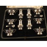 A cased silver ten piece cruet set