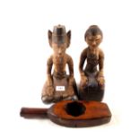 A pair of Indonesian polychrome painted seated figures plus a Chinese butter mould