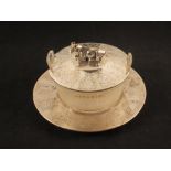 A silver and glass butter dish with cow finial,