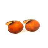A pair of 9ct gold cuff links of oval form