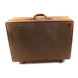 A Hartmann tweed and tan leather suitcase