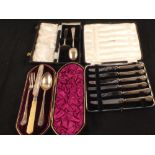 Cased silver handled tea knives and two silver christening sets