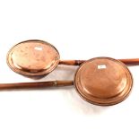 Four 19th Century copper warming pans,