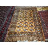 A Persian red ground rug with multiple central medallions,