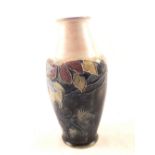 A Royal Doulton stoneware blue ground floral vase