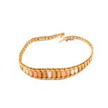 A 9ct gold tri colour bracelet