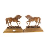 A pair of Victorian brass horse doorstops