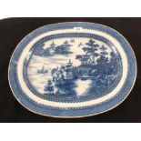 An early 19th Century blue and white chinoiserie meat plate