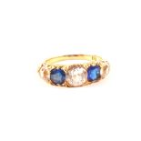 A 15ct gold blue and white sapphire five stone ring