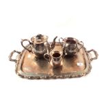 An American Oneida silver plated two handled tray plus a three piece tea set