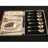 A case of six silver enamelled coffee spoons plus other cutlery (as found)