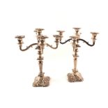 A pair of silver plated four branch candelabras