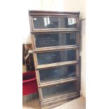A five tiered Globe-Wernicke Co Ltd bookcase (one pain cracked)