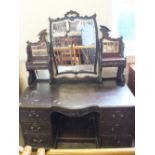 A large Victorian mahogany six drawer dressing table with mirror back