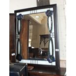 A modern Art Nouveau style stained glass wall mirror