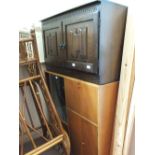 An oak two door cupboard and a modern cabinet