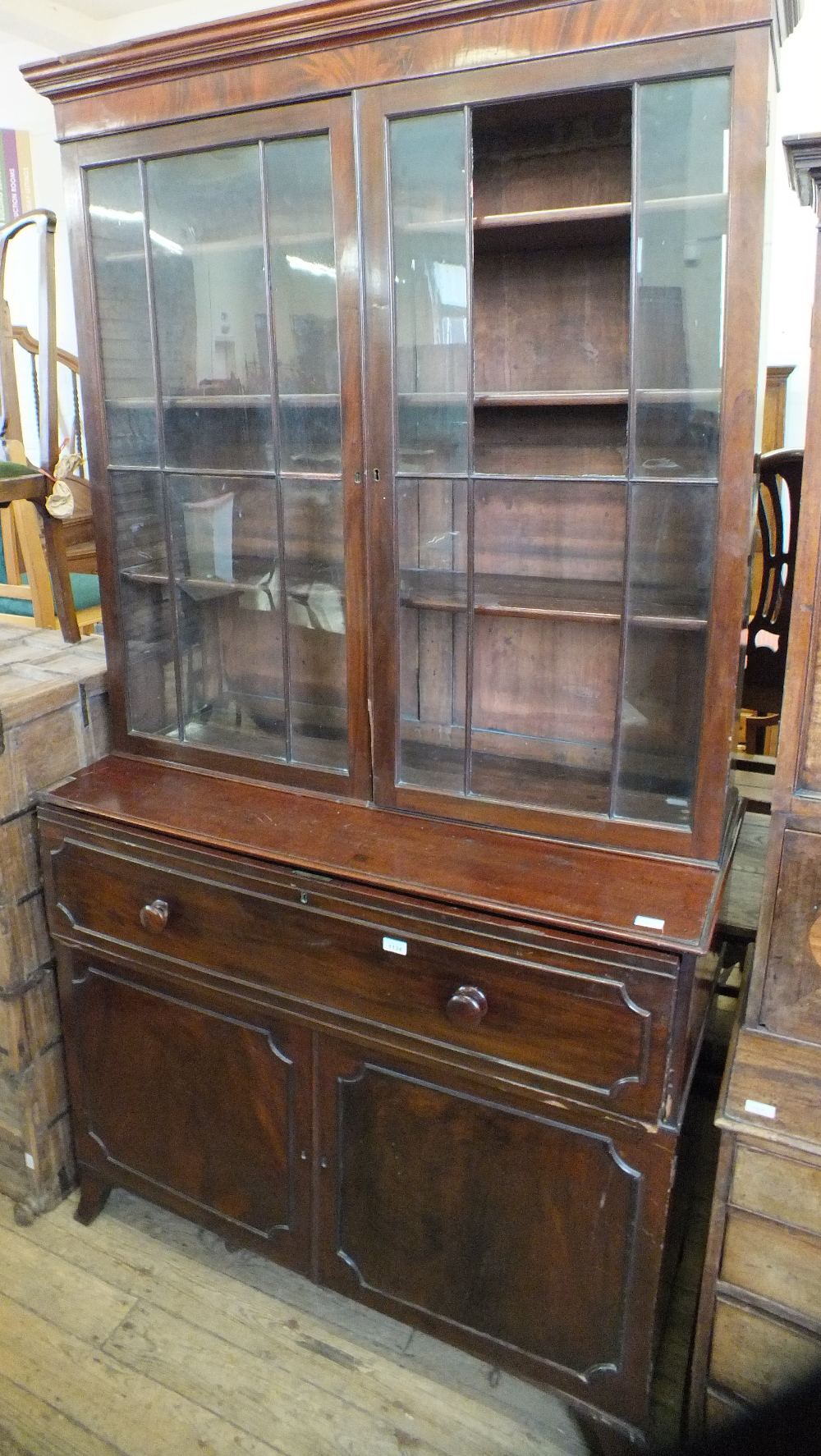 A 19th Century mahogany cupboard secretaire bookcase with astral glazed doors