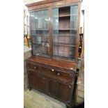 A 19th Century mahogany cupboard secretaire bookcase with astral glazed doors