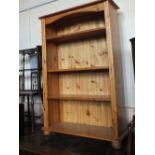A modern pine flour shelved bookcase