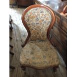 A Victorian mahogany balloon back nursing chair