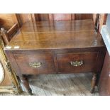 A Georgian oak two drawer chest on turned legs (formally a linen press)