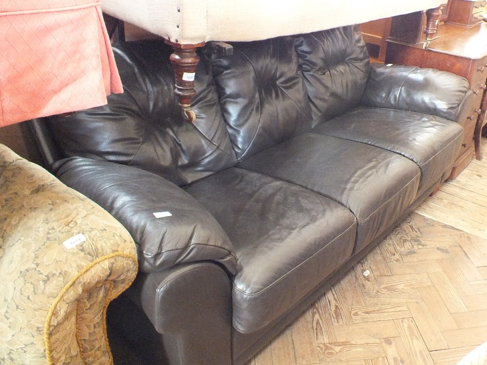 A modern brown three seater sofa