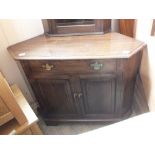 An oak glazed corner cabinet plus one other oak floor standing corner cupboard
