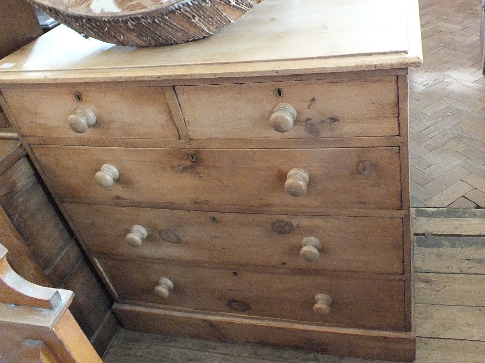 A Victorian pine chest of two short over three long drawers