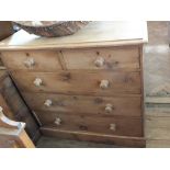 A Victorian pine chest of two short over three long drawers