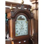 A 19th Century oak eight day long case clock with painted arched dial,