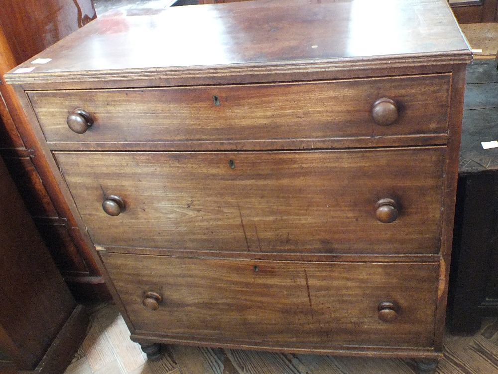 A 19th Century mahogany chest of three graduated drawers