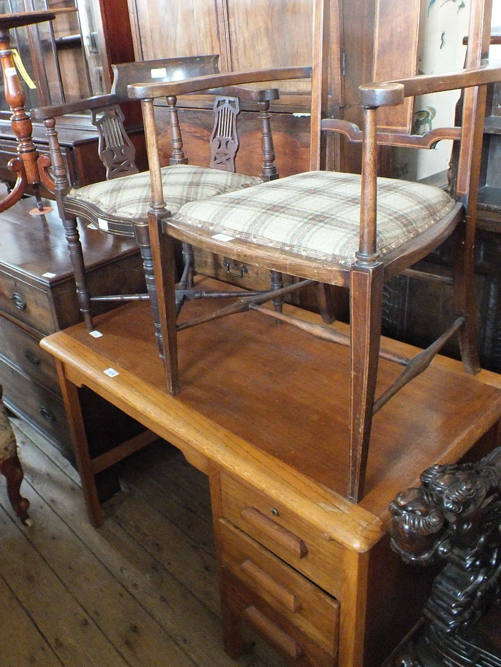 An Edwardian inlaid elbow chair and tub chair plus an oak pedestal desk