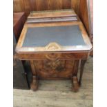 A Victorian inlaid walnut Davenport with brass gallery and four drawers