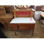 An Edwardian satin wood white marble topped wash stand with red Art Nouveau floral tiled back