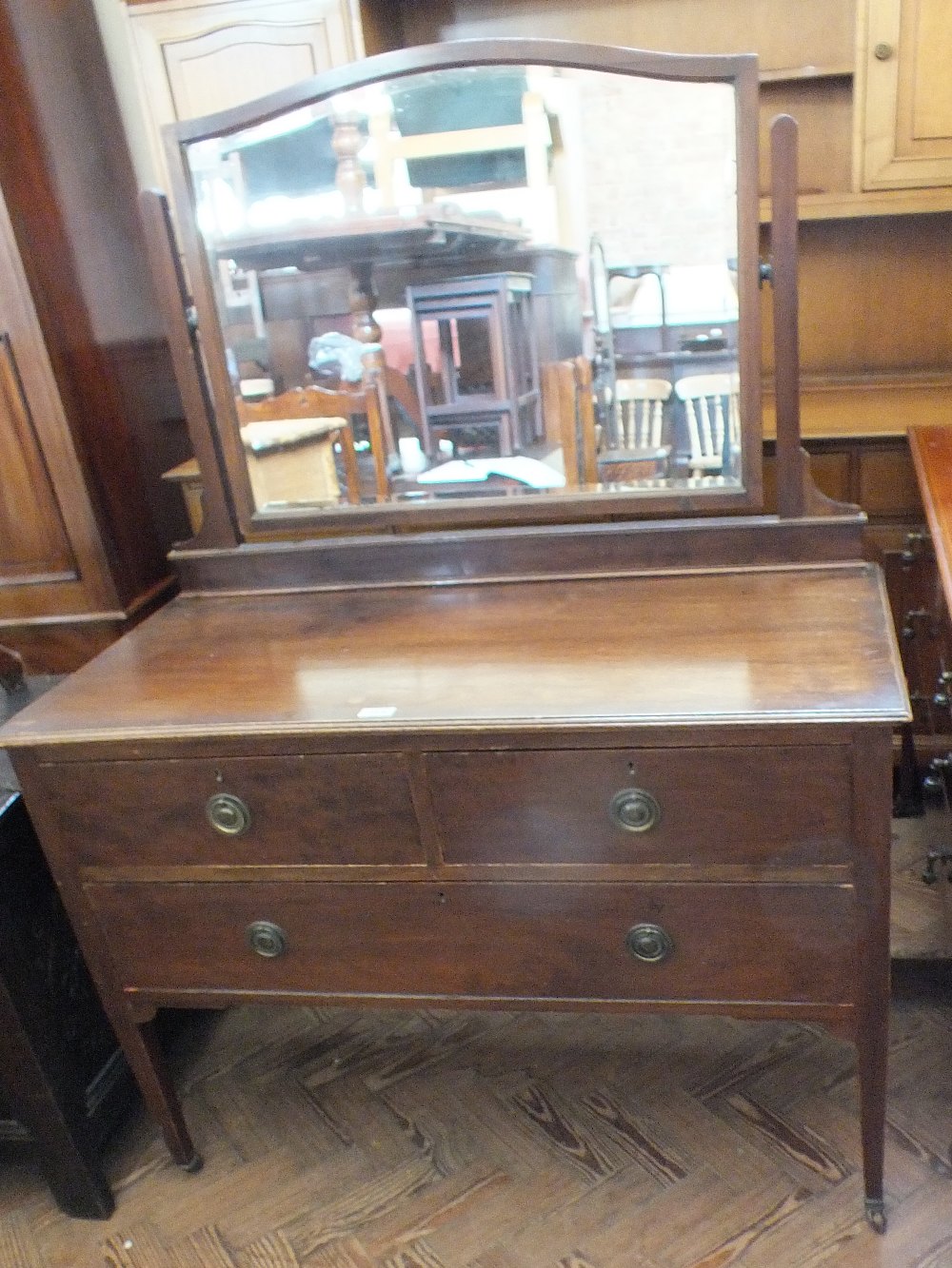 A mahogany two over one drawer dressing table