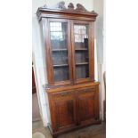 An Edwardian mahogany glazed two door sideboard bookcase