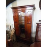 An Edwardian mahogany inlaid single door wardrobe